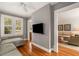Cozy living room with hardwood floors and neutral decor with seamless access to other living spaces at 4220 Club Ne Dr, Atlanta, GA 30319