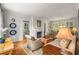 Inviting living room with hardwood floors, natural light, fireplace, and neutral furnishings at 4220 Club Ne Dr, Atlanta, GA 30319