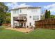 Backyard featuring a well-maintained lawn, patio, deck, and exterior elevation at 1268 Windsor Glen Dr, Douglasville, GA 30134