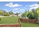 Expansive backyard with a wood fence, offering plenty of space for outdoor activities at 1268 Windsor Glen Dr, Douglasville, GA 30134