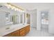 Bright bathroom with dual vanities, tile floors, a soaking tub, and a separate shower at 1268 Windsor Glen Dr, Douglasville, GA 30134