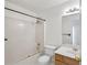 Bright bathroom with a shower-tub combo, white tile, and a vanity sink at 1268 Windsor Glen Dr, Douglasville, GA 30134