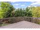 Well-maintained wooden deck with backyard greenery and a peaceful atmosphere at 1268 Windsor Glen Dr, Douglasville, GA 30134