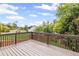Large wooden deck with a railing and backyard views, ideal for outdoor entertaining at 1268 Windsor Glen Dr, Douglasville, GA 30134