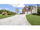Brick home with a long drive and a well-maintained front lawn at 1268 Windsor Glen Dr, Douglasville, GA 30134