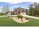 Beautiful two-story brick home with well-maintained landscaping and a spacious driveway at 1268 Windsor Glen Dr, Douglasville, GA 30134