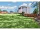 Large grassy backyard with a wood fence and mature trees, offering privacy and space at 1268 Windsor Glen Dr, Douglasville, GA 30134