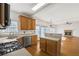 Bright kitchen featuring wood cabinets, stainless steel appliances, and an eat-in island at 1268 Windsor Glen Dr, Douglasville, GA 30134