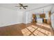 Open living space with hardwood floors that leads to the kitchen area at 1268 Windsor Glen Dr, Douglasville, GA 30134