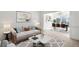 Bright living room with modern decor and an open floor plan adjacent to the dining area at 1268 Windsor Glen Dr, Douglasville, GA 30134