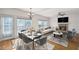 Cozy living and dining space with fireplace and ample natural light at 1268 Windsor Glen Dr, Douglasville, GA 30134