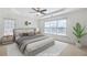 Inviting main bedroom featuring neutral colors, a tray ceiling, and natural lighting at 1268 Windsor Glen Dr, Douglasville, GA 30134