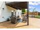 Covered outdoor patio seating area for relaxing and entertaining in the backyard at 1268 Windsor Glen Dr, Douglasville, GA 30134