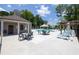 Inviting community pool area featuring lounge chairs, tables, and a pergola for shade and relaxation at 2852 Evanshire Ave # 114, Duluth, GA 30096