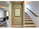 Hallway and stairway with shiplap walls, modern decor, wooden stairs and railing at 2852 Evanshire Ave # 114, Duluth, GA 30096