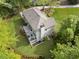 Aerial view of a home with a deck surrounded by a lush green yard at 660 Willow Knoll Se Dr, Marietta, GA 30067
