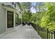 Expansive back deck featuring an outdoor seating area and views of the lush greenery at 660 Willow Knoll Se Dr, Marietta, GA 30067