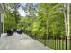 Spacious back deck with outdoor seating area overlooking a beautiful wooded backyard at 660 Willow Knoll Se Dr, Marietta, GA 30067