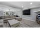 Finished basement with a large sectional, flat screen television, and plenty of entertaining space at 660 Willow Knoll Se Dr, Marietta, GA 30067