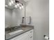 Bathroom with a gray countertop, white cabinets, and a modern light fixture at 660 Willow Knoll Se Dr, Marietta, GA 30067