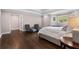 Bedroom featuring hardwood floors and lounge chairs near large windows at 660 Willow Knoll Se Dr, Marietta, GA 30067