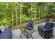 Outdoor deck with furniture overlooking a lush green wooded area at 660 Willow Knoll Se Dr, Marietta, GA 30067