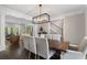 Open-concept dining room with view to living room and beautiful backyard at 660 Willow Knoll Se Dr, Marietta, GA 30067