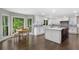 Spacious white kitchen featuring a large island with seating, stainless appliances, and a lovely view at 660 Willow Knoll Se Dr, Marietta, GA 30067