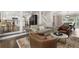 Inviting living room with hardwood floors, comfortable seating, and view into the eat-in kitchen at 660 Willow Knoll Se Dr, Marietta, GA 30067