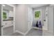 Bright mudroom with built-ins and a view into the laundry room at 660 Willow Knoll Se Dr, Marietta, GA 30067