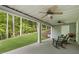 Inviting covered outdoor patio perfect for relaxing or entertaining with ceiling fans and comfortable seating at 660 Willow Knoll Se Dr, Marietta, GA 30067