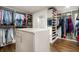Spacious walk-in closet with custom shelves, drawers, and a center island for maximum storage at 660 Willow Knoll Se Dr, Marietta, GA 30067