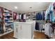 Organized walk-in closet with custom shelving and an island, providing ample space for clothing and accessories at 660 Willow Knoll Se Dr, Marietta, GA 30067