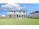 Two-story home with brick and siding on display along with a large, well-kept lawn and blue sky at 108 Aj Welch Jr Way, Mcdonough, GA 30252