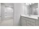 Bathroom with vanity with a sink, quartz countertop and a view of a bath and shower at 108 Aj Welch Jr Way, Mcdonough, GA 30252