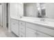 Bathroom vanity with double sinks, white cabinets and modern fixtures near glass enclosed shower at 108 Aj Welch Jr Way, Mcdonough, GA 30252
