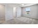 Bright bedroom featuring plush carpeting, ceiling fan and a window view of the outdoors at 108 Aj Welch Jr Way, Mcdonough, GA 30252