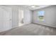 Bedroom with plush carpet, ceiling fan, and a view from the window at 108 Aj Welch Jr Way, Mcdonough, GA 30252