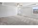 Spacious bedroom with tray ceiling, fan and plush carpeting has a light and airy feel at 108 Aj Welch Jr Way, Mcdonough, GA 30252