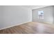 Spacious bedroom with hardwood floors and a bright window at 108 Aj Welch Jr Way, Mcdonough, GA 30252