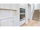 Modern kitchen with white cabinets, quartz countertops, and stainless steel appliances at 108 Aj Welch Jr Way, Mcdonough, GA 30252