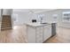 Elegant kitchen with island, open to living area and staircase at 108 Aj Welch Jr Way, Mcdonough, GA 30252