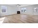 Cozy living room with a fireplace and lots of natural light at 108 Aj Welch Jr Way, Mcdonough, GA 30252
