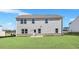 Exterior view of a two-story home with a spacious, well-maintained lawn at 124 Aj Welch Jr Way, Mcdonough, GA 30252