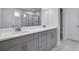 A bathroom with double sinks and vanity, marble countertops and a glass shower at 124 Aj Welch Jr Way, Mcdonough, GA 30252