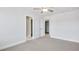 Spacious bedroom with plush carpet, neutral walls, and two doors for closet and bathroom access at 124 Aj Welch Jr Way, Mcdonough, GA 30252