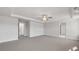 Large, bright bedroom featuring tray ceiling, a fan and ensuite bathroom at 124 Aj Welch Jr Way, Mcdonough, GA 30252