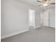 Bright bedroom with carpet flooring, baseboards, trim, and a closet at 124 Aj Welch Jr Way, Mcdonough, GA 30252