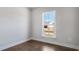 Cozy bedroom with hardwood floors, ample natural light, and a serene atmosphere, perfect for relaxation at 124 Aj Welch Jr Way, Mcdonough, GA 30252