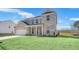 Beautiful two-story brick home with a covered front porch and lush green lawn, reflecting classic elegance at 124 Aj Welch Jr Way, Mcdonough, GA 30252